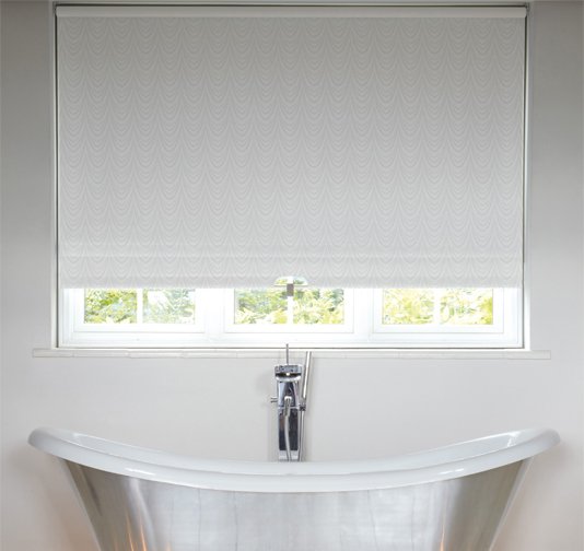 An image showing waterproof white roller blinds in a contemporary bathroom